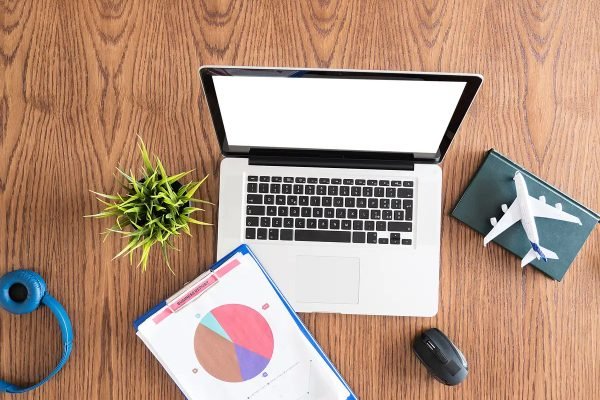 Businessman traveler concept image. Top view flatlay on a wooden desk