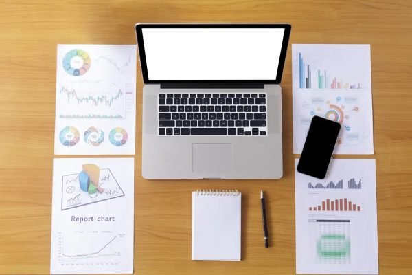 Directly above shot of laptop with calculator on table